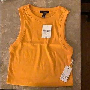 Selling an orange semi-cropped tank top
